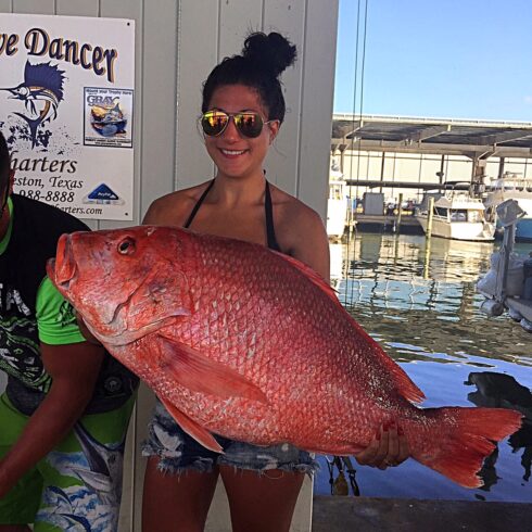 Wave Dancer Holding a Big Beautiful Red Snapper